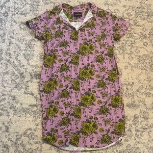 Wildfang "The Empower Shirt Dress" in a lavender floral pattern.